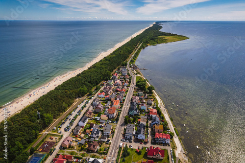 Summer view from the air of the Hel Peninsula, a calm and nice landscape over Chalupy village.
