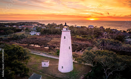 Ocracoke Lighthouse on Ocracoke , North Carolina at sunset.The lighthouse was built to help guide ships through Ocracoke Inlet into Pamlico Sound.