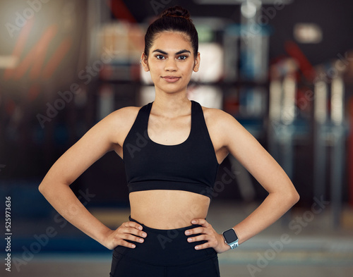Fitness, motivation and healthy woman with wellness goal for workout, exercise and training in sports gym. Portrait of personal trainer, coach and power athlete with muscle building vision