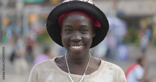 Youn black woman smile happy face portrait on a city street
