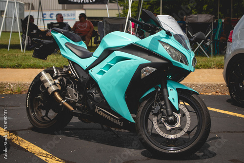 Kawasaki Ninja EX300 at a car show