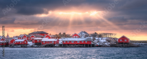 Norwegian fishing village and sea coast at sunset