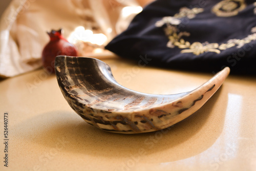 shofar (horn) isolated with rosh hashanah (jewish holiday) concept . traditional holiday symboL .In the background of a prayer arrangement and tallit sidour
