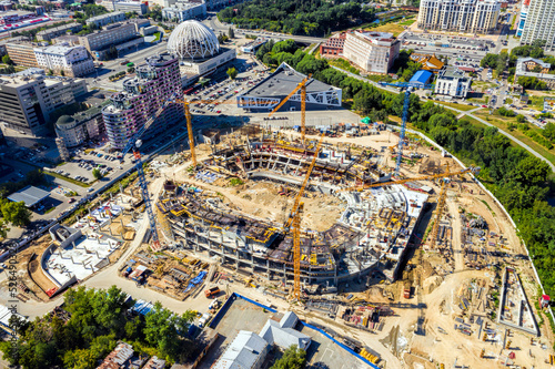 Top view of the construction of a new shopping center in a modern city