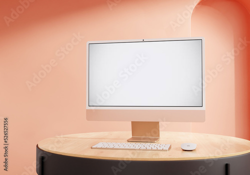 Coral iMac on the rounded table