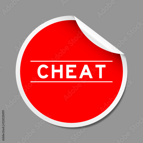 Red color peel sticker label with word cheat on gray background