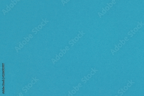 Blue paper texture. Solid blue background.