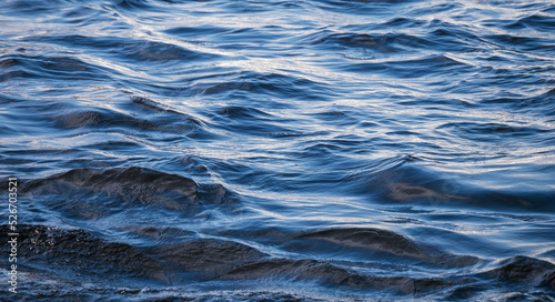 Blue sea or ocean water surface background.