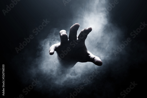 Human hand on dark background