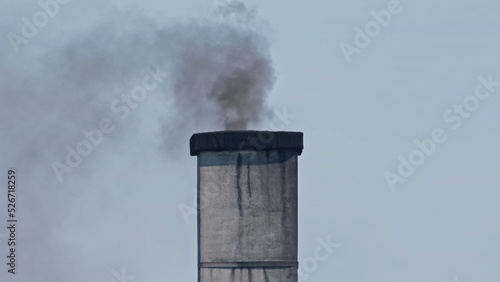 Dark Brown Smoke Coming Out Chimney Produced by Burning Low Quality Coal and Garbage 