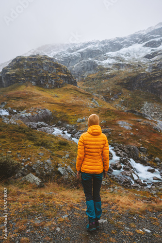 Autumn hike woman traveling in Norway healthy lifestyle outdoor adventure vacations trip in Jotunheimen park scandinavian landscape cold weather