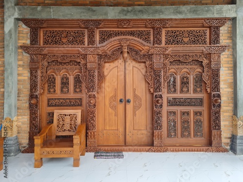 Javanese teak carved door. In Java it is known as the gebyok door. traditional wooden door