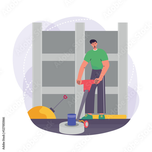 Construction worker using floor scrubbing machine