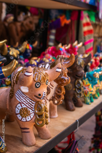Beautiful and colorful bulls of Pucara the handicraft market in the city of Pisac, in Peru. 