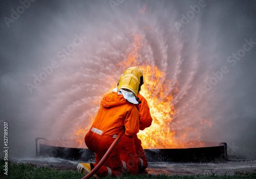  Firefighter man wearing protective fire suite and helmet with equipment and accessories is fire safety accident protection is industry safety concept.