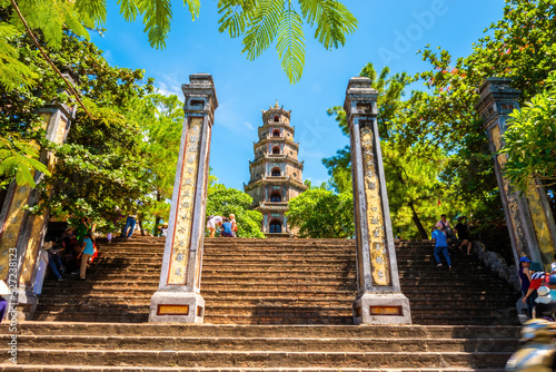 view of The Thien Mu Pagoda with many tourists. It is one of the ancient pagoda in Hue city. Near the Perfume River in Vietnam's historic city of Hue.