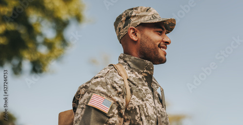 Happy young soldier returning home from the army