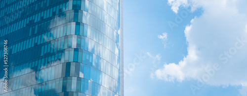 Glass wall architecture building reflection cloud and sky background.concept for modern office