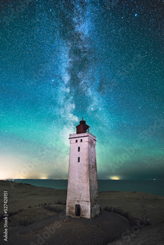Lighthouse Rubjerg Knude at night with Milky Way above it. High quality photo