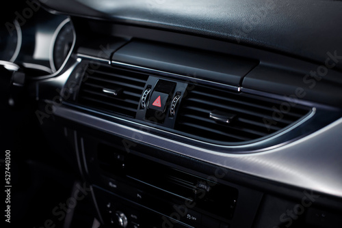 Close-up of air vent in car. Dashboard in modern car interior.