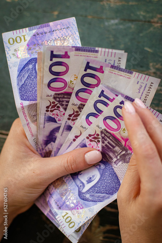 Hands holding georgian lari bills. Bunch of banknotes of Georgia money