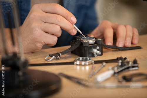 close cropped view of wrist watch being repaired