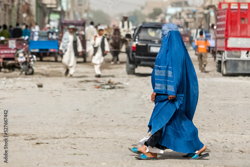 Afghan woman in hijab in Kabul, natives of Afghanistan on streets of the city