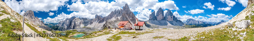 Dreizinnenhütte with small chapel in front of the Tre Cime (Drei Zinnen) and Monte Paterno (Paternkofel) panorama in the Dolomite Alps of South Tyrol in Italy