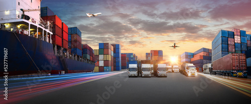 Container truck in ship port for business Logistics and transportation of Container Cargo ship and Cargo plane with working crane bridge in shipyard at sunrise, logistic import export and transport 