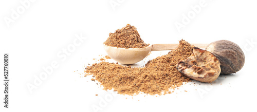 Spoon with nutmeg powder and nutmegs isolated on white background