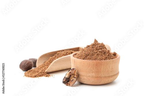 Scoop and bowl with nutmeg powder and nutmegs isolated on white background