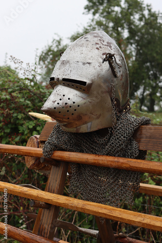 A 14th Century Pig-face bascinet helmet with a curtain of chainmail around the bottom.