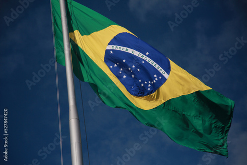 salvador, bahia, brazil - august 25, 2022: Brazil flag on a flagpole of a supermarket in Cabula neighborhood in Salvador city.