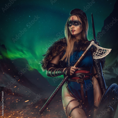 Artwork of antique nordic warrior woman with strup back longbow holding shield and axe.