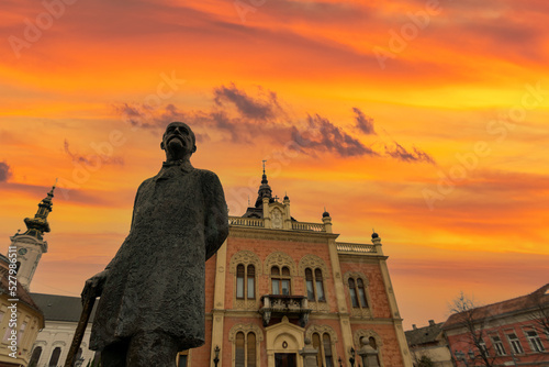 Novi Sad square, novi sad church and municipality building with sunset clouds and colors