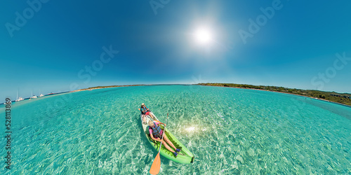 Aerial view kayak in the beach reef of Piana island, close to the Bonifacio town in Corsica of France. Drone view of people kayaking in the Mediterranean sea by Piana island.