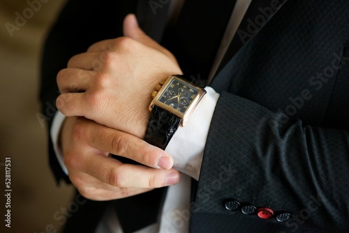 Men's hands and expensive watches