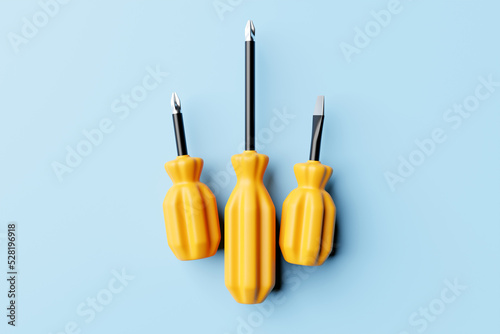 3D illustration of a yellow crosshead screwdrivers hand tool isolated on a monocrome background. 3D render and illustration of repair and installation tool