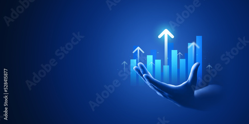 Businessman hand plan growth business graph financial chart on improvement blue background with success investment diagram marketing strategy or increase arrow stock profit data and analysis market.