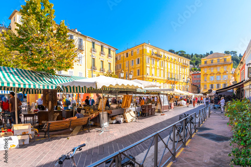 The colorful Cours Saleya outdoor market in the Vieux Nice old town area of Nice, France, on a summer day along the Cote d'Azur French Riviera.