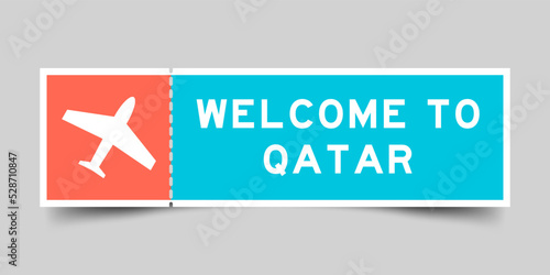 Orange and blue color ticket with plane icon and word welcome to qatar on gray background