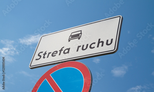 D-52 Traffic zone sign in Poland. Entering an internal road located in the traffic zone. With B-35 No parking sign below. Letters in Polish language, Strefa Ruchu means Traffic Zone.