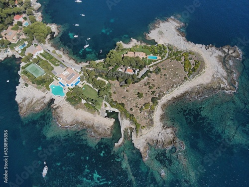 Aerial view of Cap d'Antibes and Billionaire's Bay. Beautiful rocky beach near coastal path on the Cap d'Antibes, Antibes, France. Drone view from above of Côte d’Azur near Juan-les-Pins and Cannes.