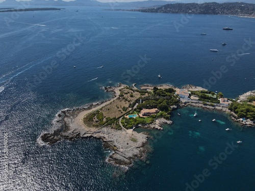 Aerial view of Cap d'Antibes and Billionaire's Bay. Beautiful rocky beach near coastal path on the Cap d'Antibes, Antibes, France. Drone view from above of Côte d’Azur near Juan-les-Pins and Cannes.