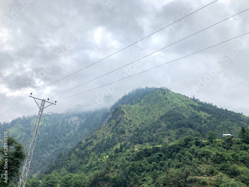 Electricity cables and poles in hills
