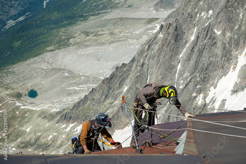 Workers at the cableway station. Aiguille du Midi, Mont Blanc France
