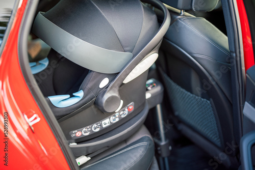 Isofix connection standard to fasten childrens carseat to car interior. Safety and transport concept.