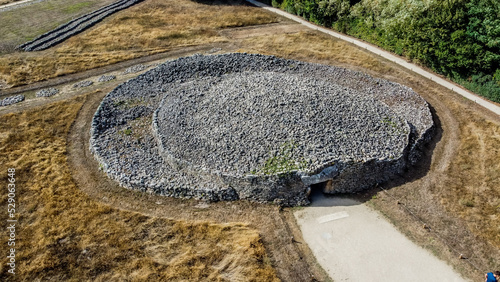 Aerial view of the Locmariaquer megalithic site near Carnac in Brittany, France - Dolmen and cairns of the "Table des Marchands" (Merchant's table) gallery grave in Morbihan