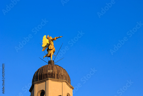 statue of the angel on the bell tower of the Church of Santa Maria di Castello in Udine