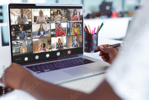 African american businesswoman having video call with colleagues